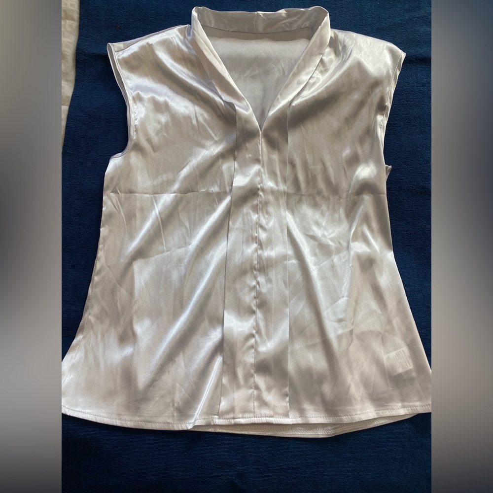 2 white blouses and some white pants.